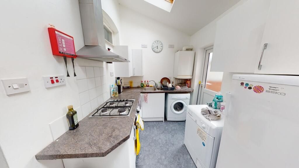 Property photo 3 of 7 Bright And Tidy Kitchen Featuring Modern Appliance...