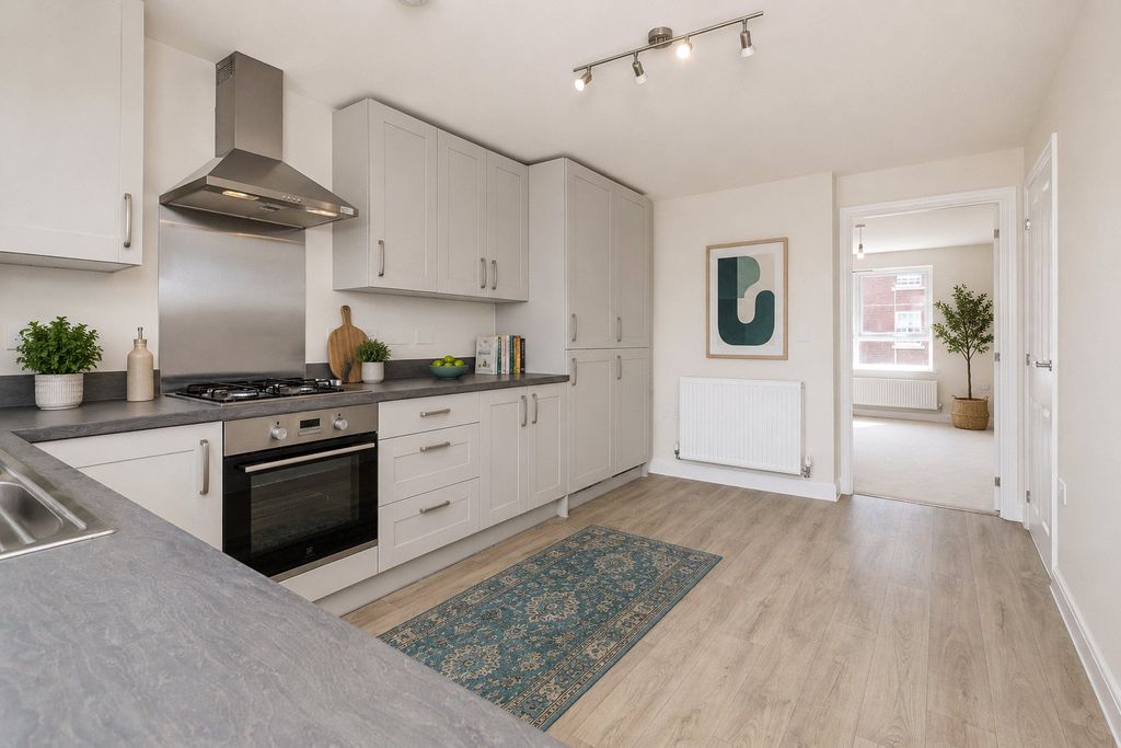 Property photo 3 of 7 Typical Kitchen