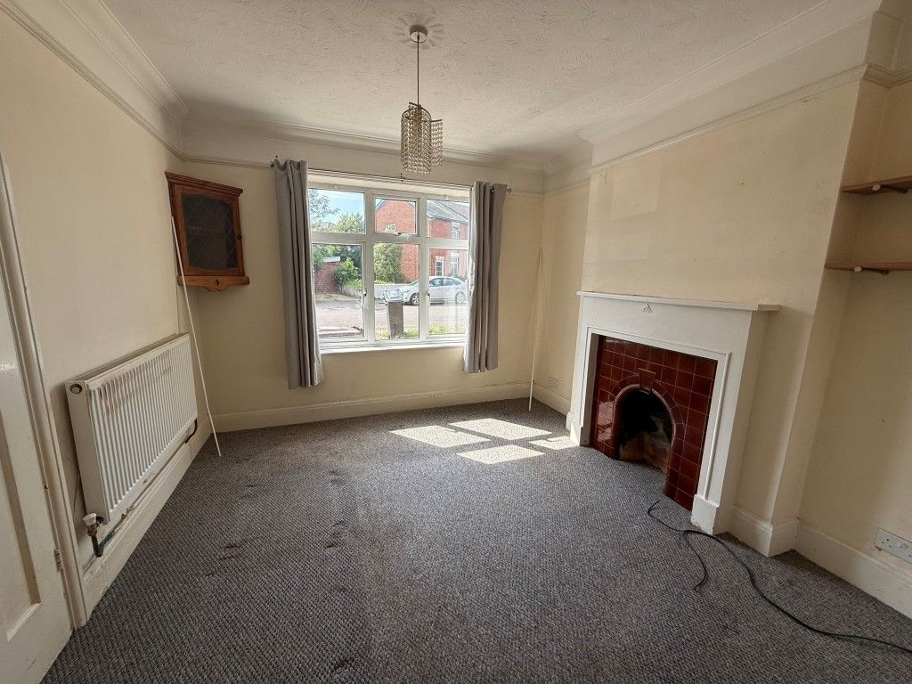 Property photo 2 of 12 Carpeted Lounge With Fireplace And Bay Window