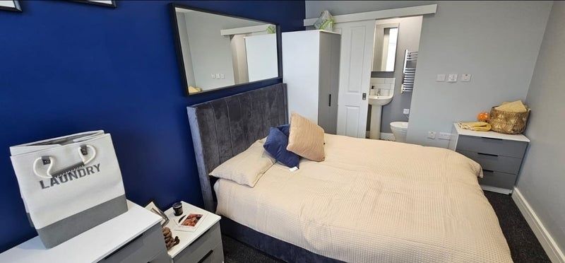 Property photo 3 of 17 A Stylish Master Bedroom Featuring A Comfortable d...