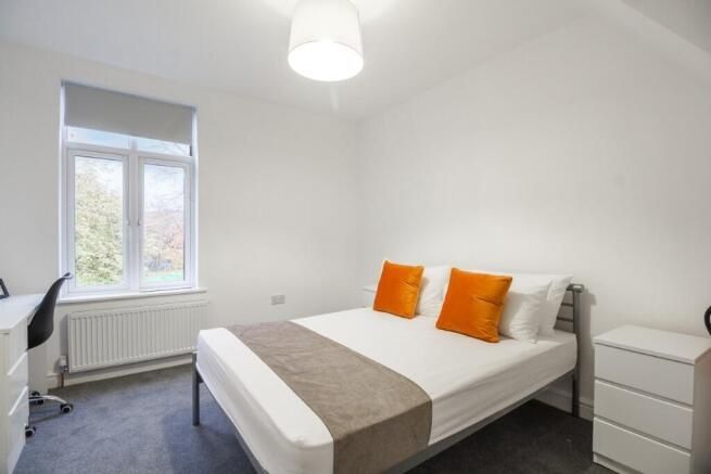 Property photo 3 of 10 A Bright And Tidy Bedroom Featuring A Comfortable ...