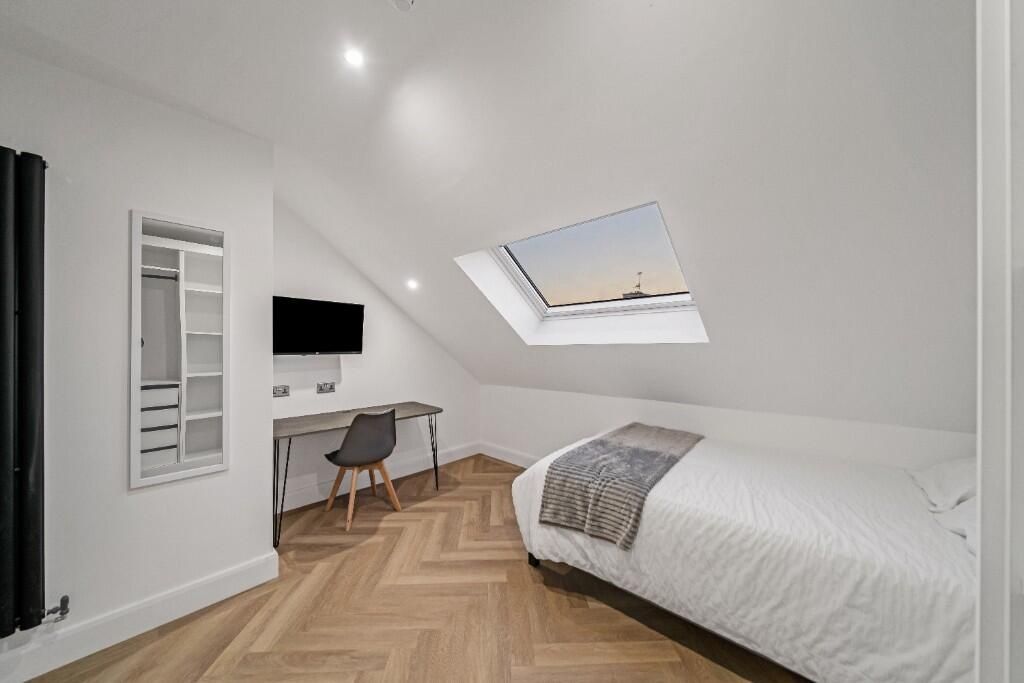 Property photo 1 of 10 A Clean And Bright Small Bathroom Featuring A Whit...