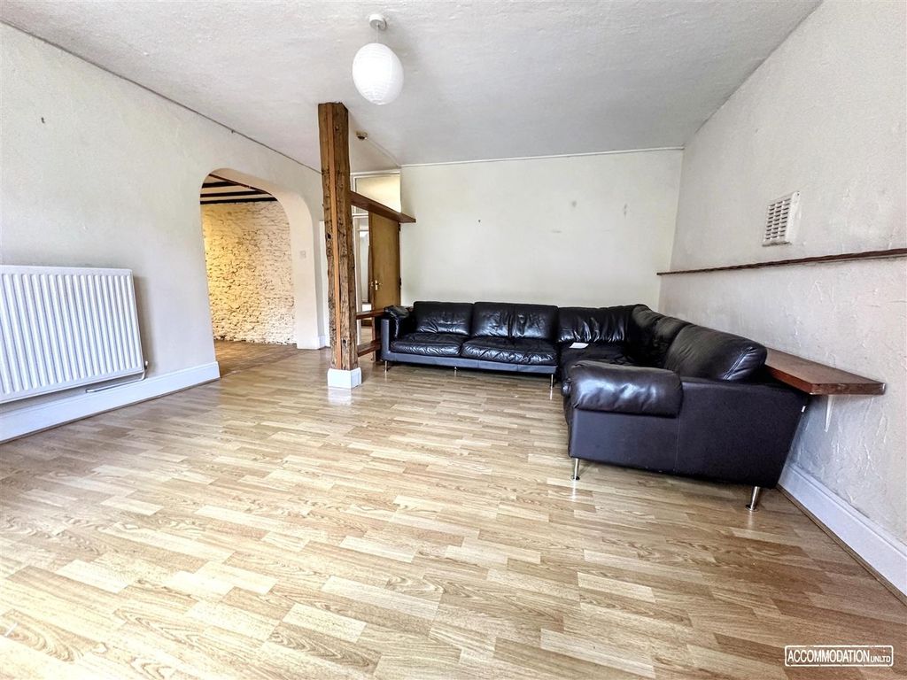 Property photo 3 of 10 Spacious Living Area With Sleek Leather Seating...