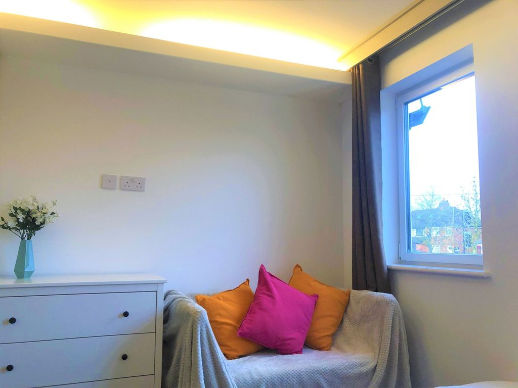 Property photo 3 of 6 A Cozy Living Space Featuring A Comfortable Sofa A...