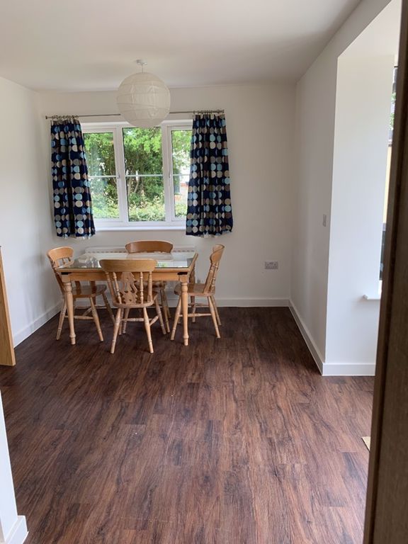 Property photo 1 of 7 A Bright And Inviting Living Room With A Stylish d...