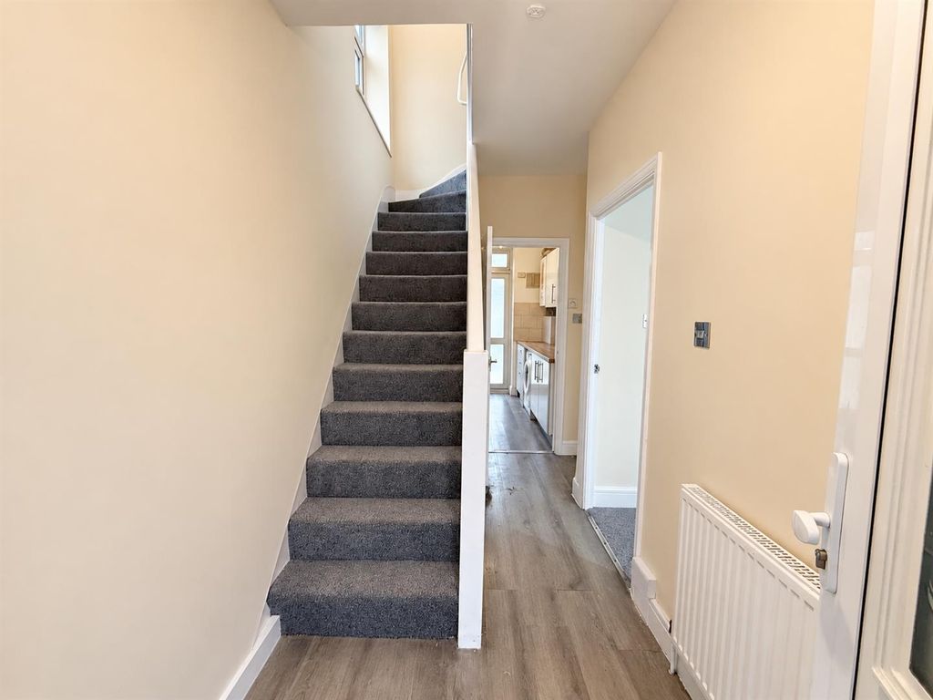 Property photo 2 of 14 Bright Neutral Hallway With Grey Staircase.Png