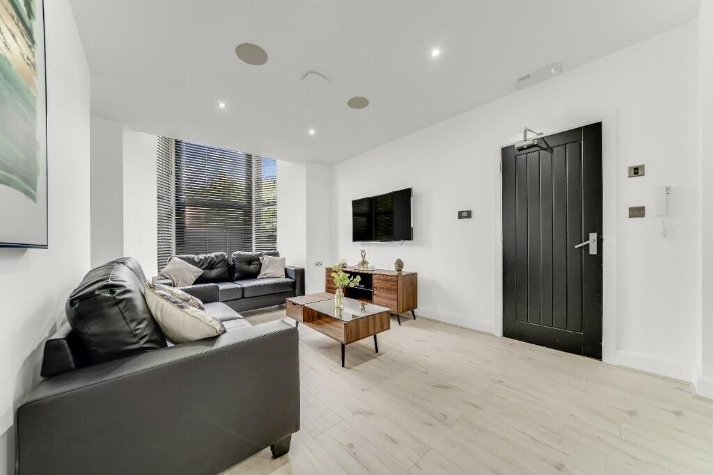 Property photo 1 of 15 A Modern, Bright Living Room With Large Windows Al...