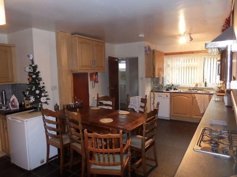 Property photo 2 of 12 A Bright And Welcoming Living Room Featuring A Lar...