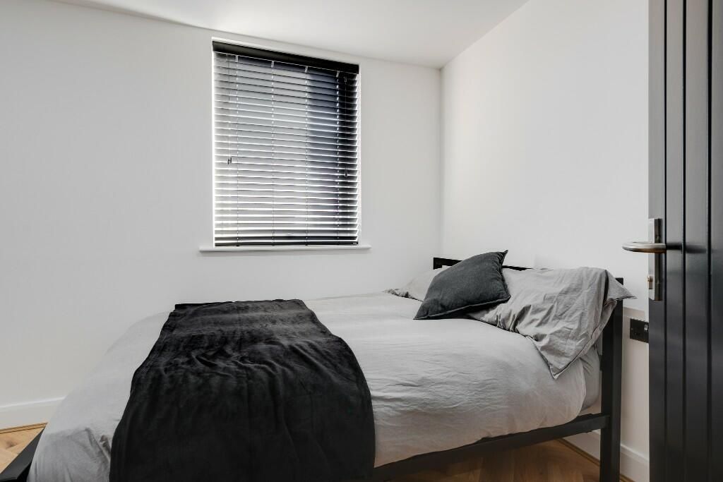 Property photo 2 of 14 A Bright And Tidy Master Bedroom With Modern Decor...