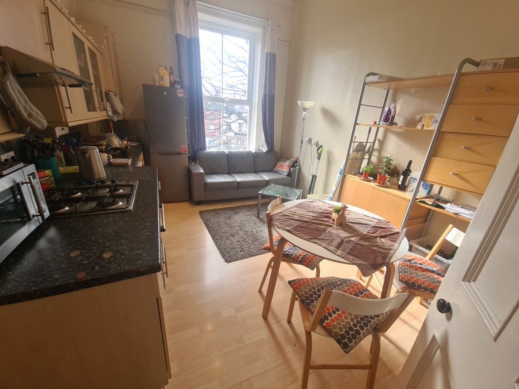 Property photo 3 of 10 A Bright And Welcoming Kitchen Featuring Wooden Ca...