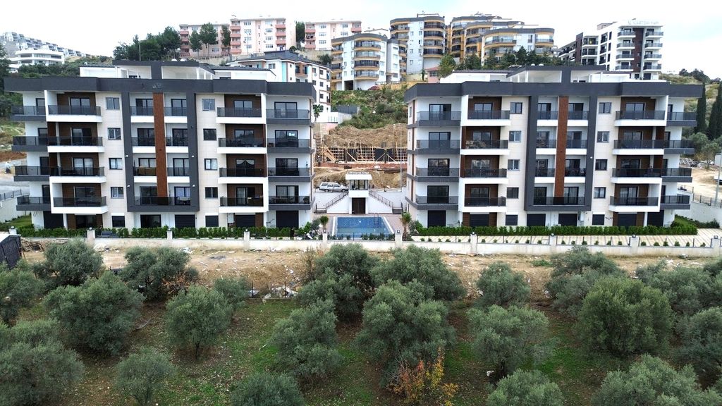 Property photo 1 of 15 Versatile Apartments In Kusadasi For Sale With A Shared Pool - A Modern Apartment Complex