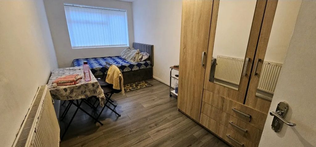 Property photo 3 of 8 Cozy Double Bedroom Featuring A Comfortable Bed, A...
