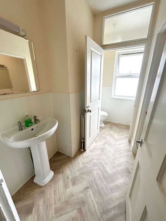 Property photo 2 of 8 Bright And Well-Maintained Bathroom Featuring Mode...