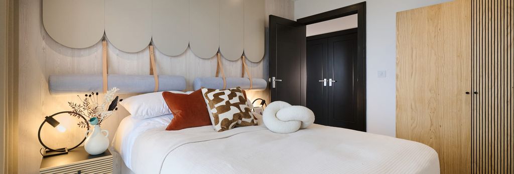 Property photo 3 of 5 Made Up Bed With Bedside Table, Cloud Pattern Wall Hanging Over Bed, Wooden Wardrobe