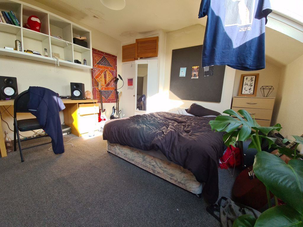 Property photo 2 of 31 A Spacious And Well-Lit Master Bedroom Featuring A...