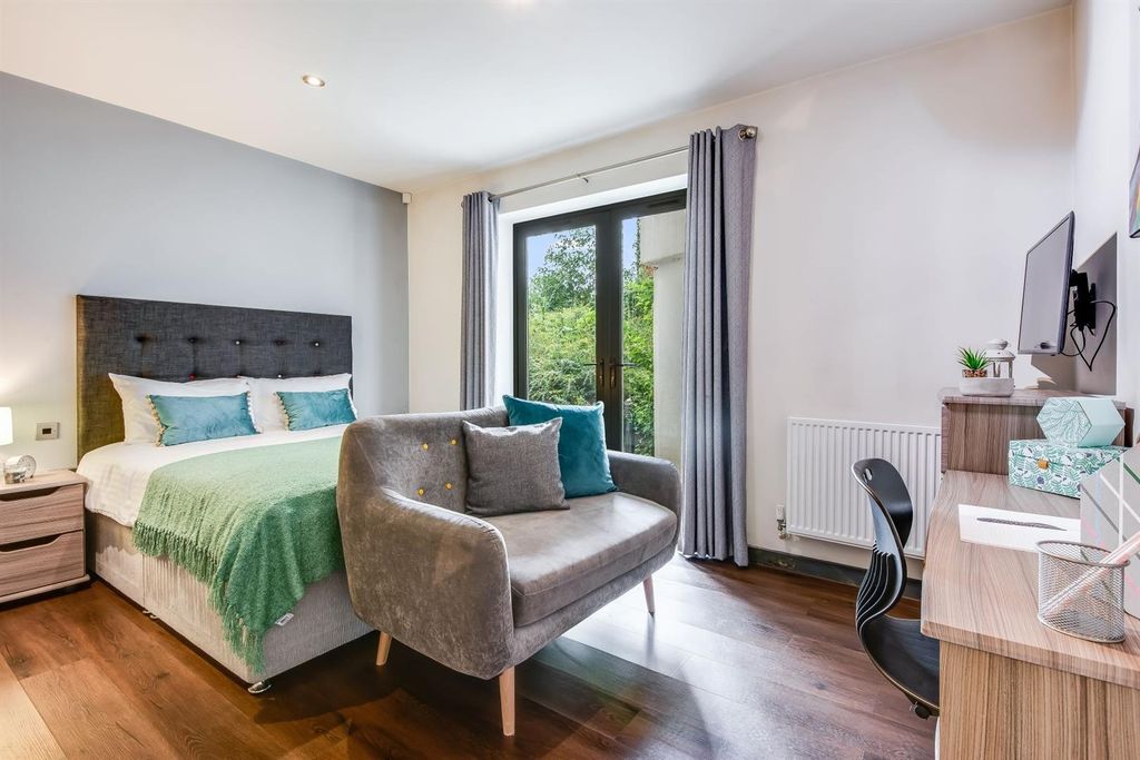 Property photo 1 of 6 Spacious Bedroom With Sofa And Natural Light...