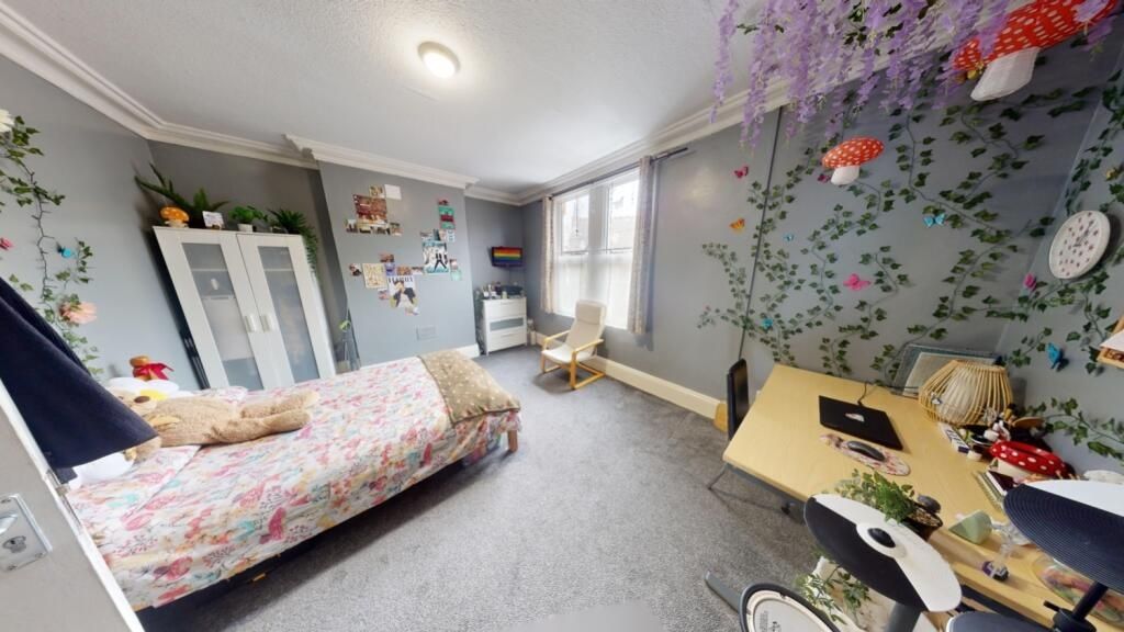 Property photo 2 of 10 Bright And Inviting Master Bedroom Featuring A Coz...