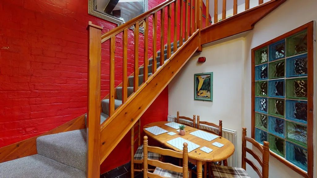 Property photo 1 of 13 A Charming Staircase Leading To An Inviting Upper ...