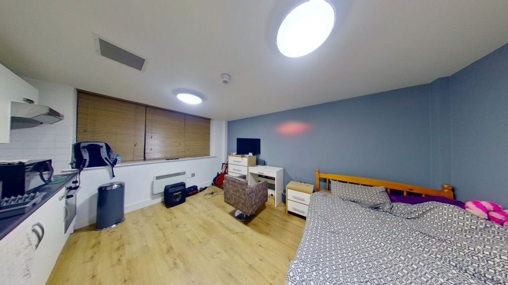 Property photo 1 of 4 A Tidy Double Bedroom Featuring Two Beds, A Desk W...