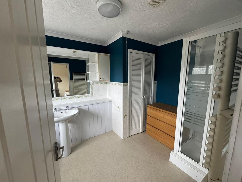 Property photo 2 of 5 Spacious Bathroom With Modern Blue Accent Walls...
