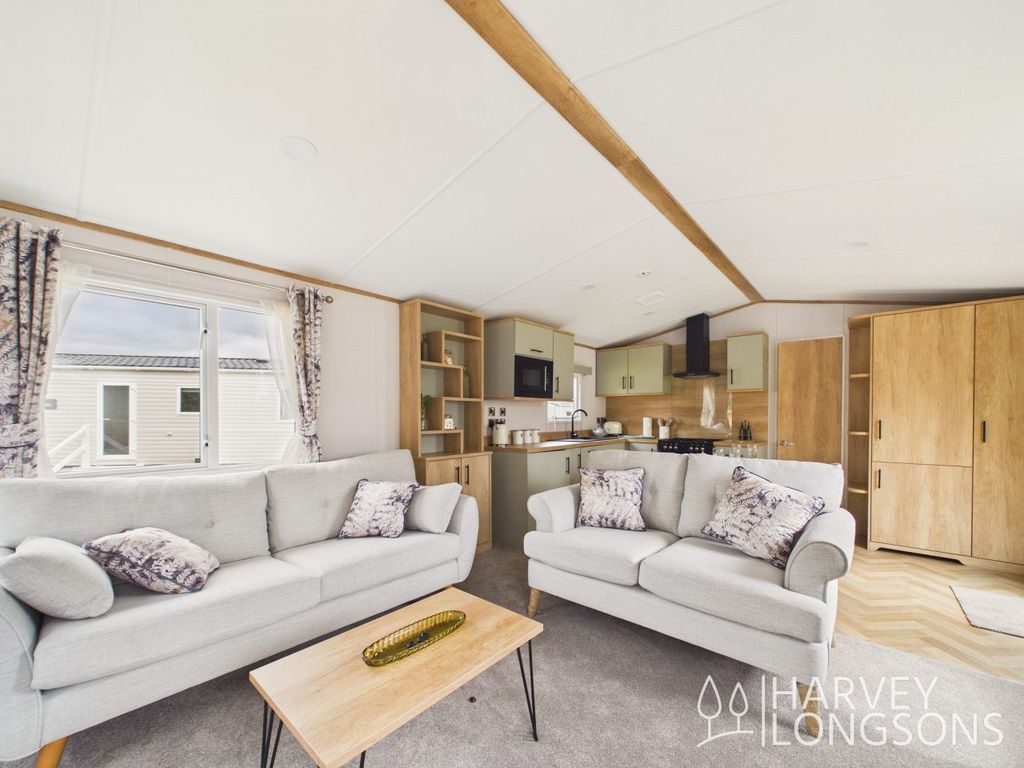 Property photo 1 of 17 Spacious Lounge With Freestanding Sofas And Feature Fireplace In Carnaby The Regis