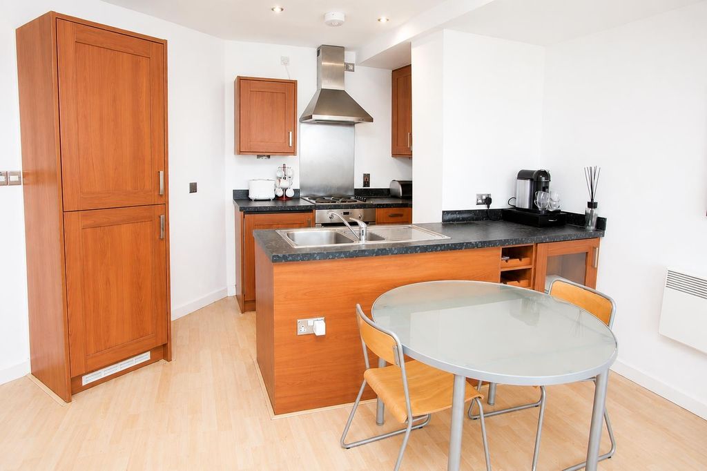 Property photo 3 of 13 Modern Kitchen With Stylish Dining Area...