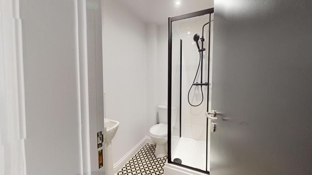 Property photo 1 of 23 A Modern And Clean Bathroom Featuring A Stylish Sh...