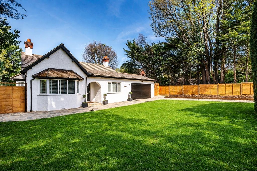 Property photo 1 of 11 Charming White Bungalow On Lush Lawn.Png