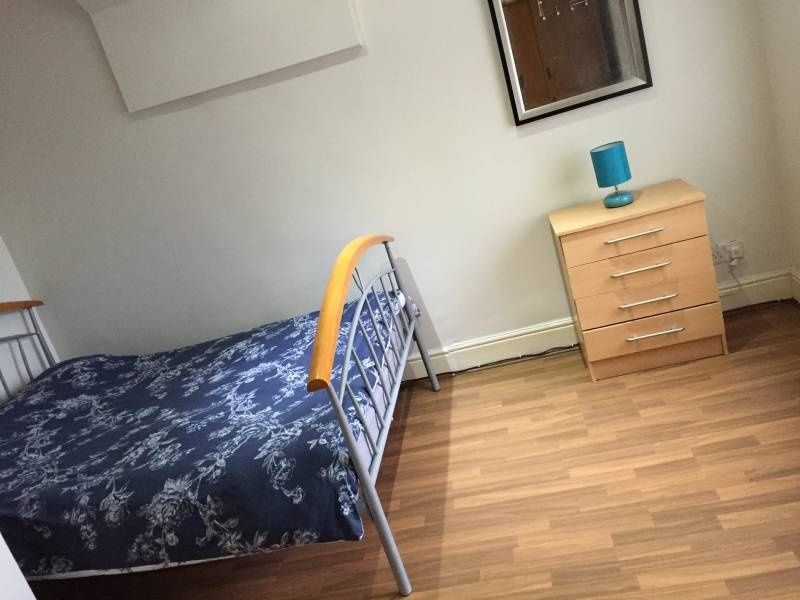 Property photo 3 of 10 A Tidy Single Bedroom Featuring A Neat Metal-Frame...