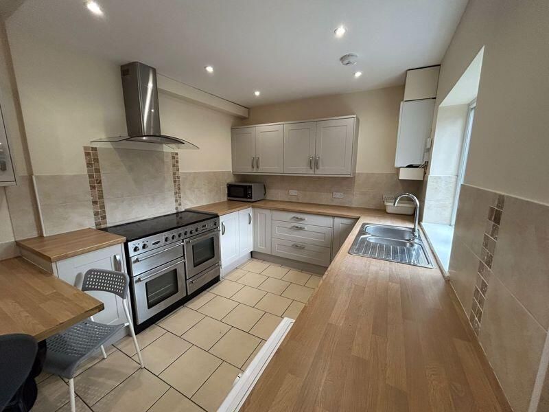 Property photo 2 of 6 Bright And Well-Maintained Kitchen Featuring Ample...