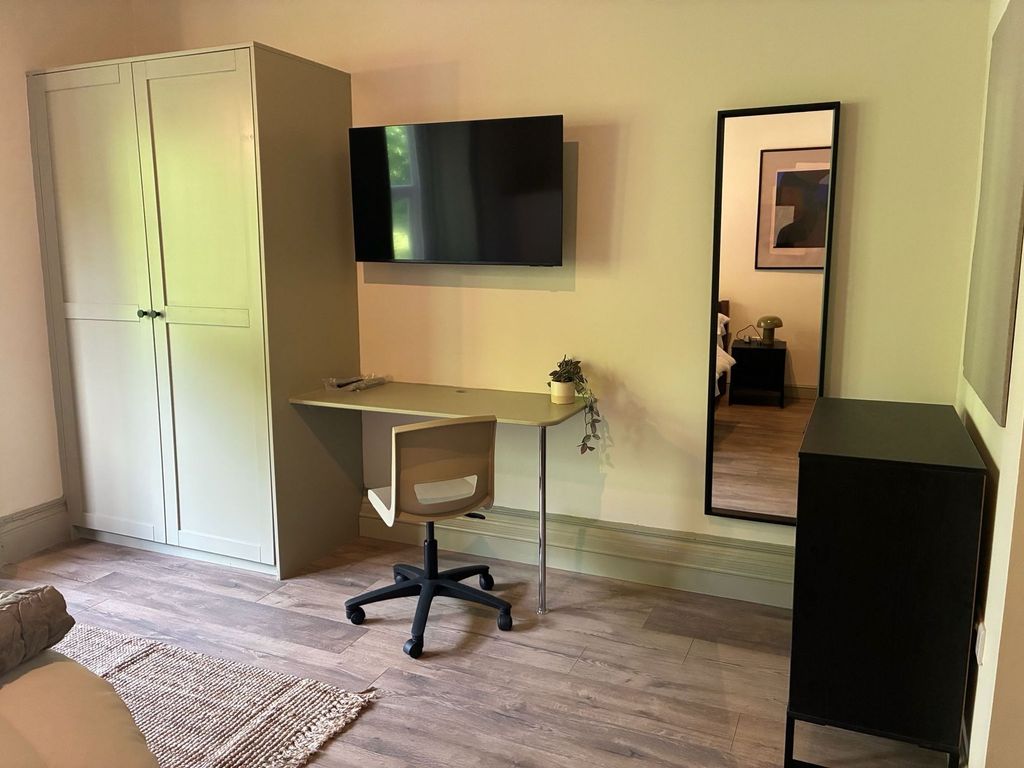 Property photo 2 of 5 Modern Study Area With A Wall-Mounted TV....