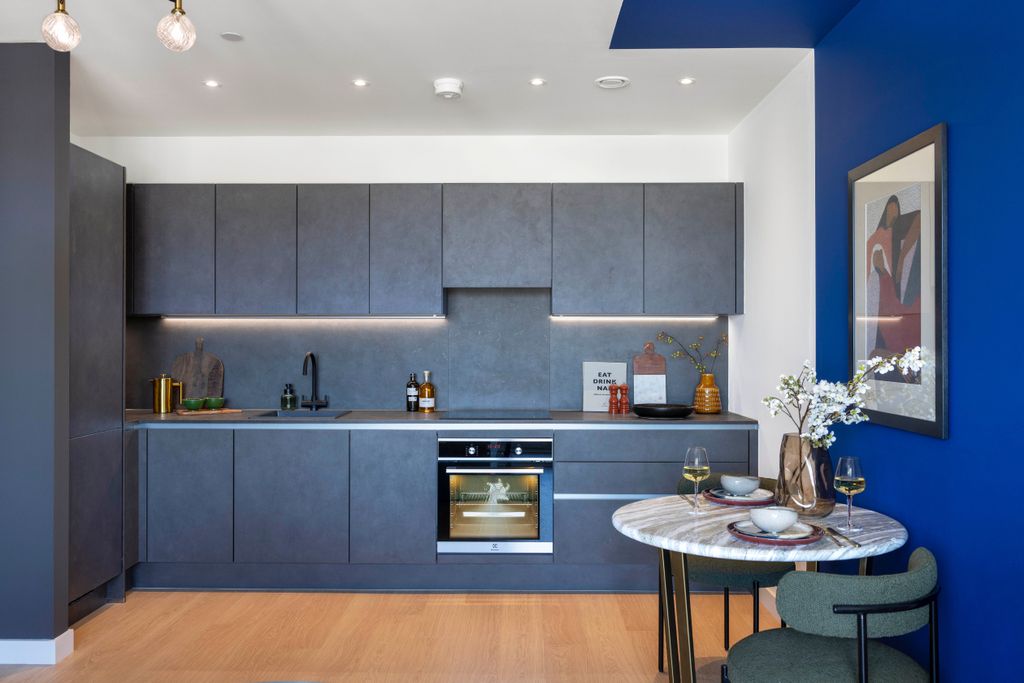 Property photo 3 of 7 Avedon Apartments - Dark Stone Kitchen