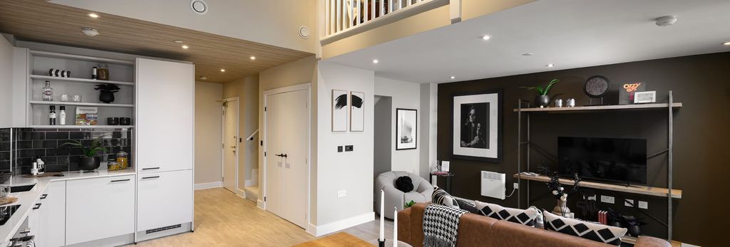 Property photo 3 of 5 View Of A Modern Designed Living Space With Kitchenette Behind.