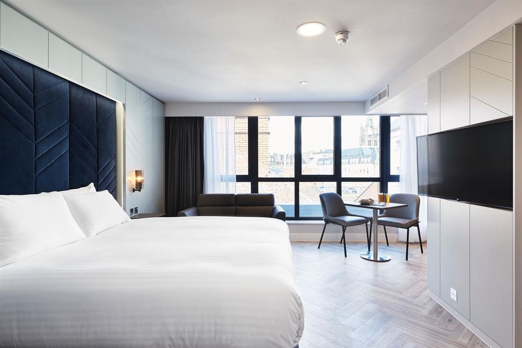 Property photo 1 of 5 Bright, Modern Twin Bedroom With Two Neatly Made B...