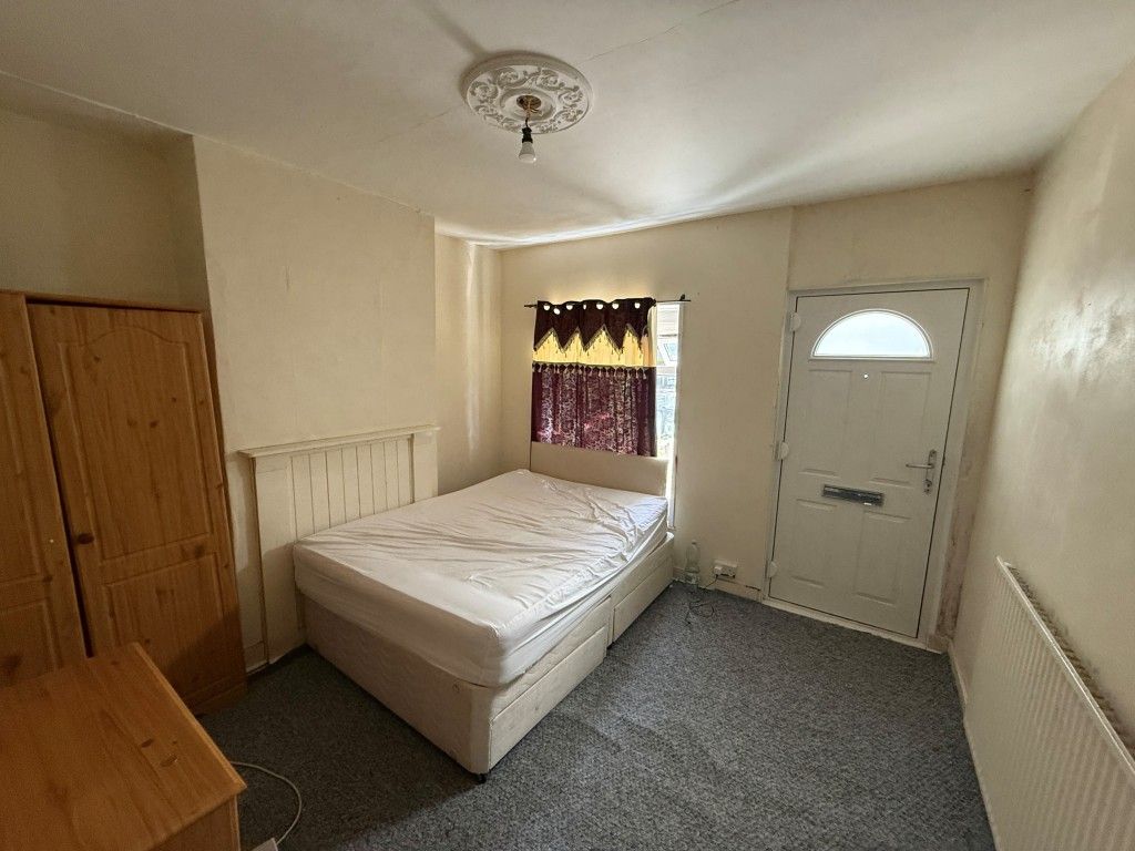 Property photo 2 of 11 Living Room With Bed In It