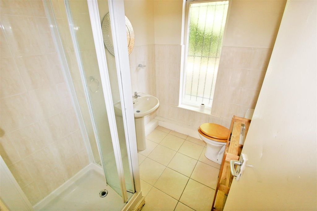 Property photo 3 of 6 A Bright Bathroom Featuring A Spacious Shower Cubi...
