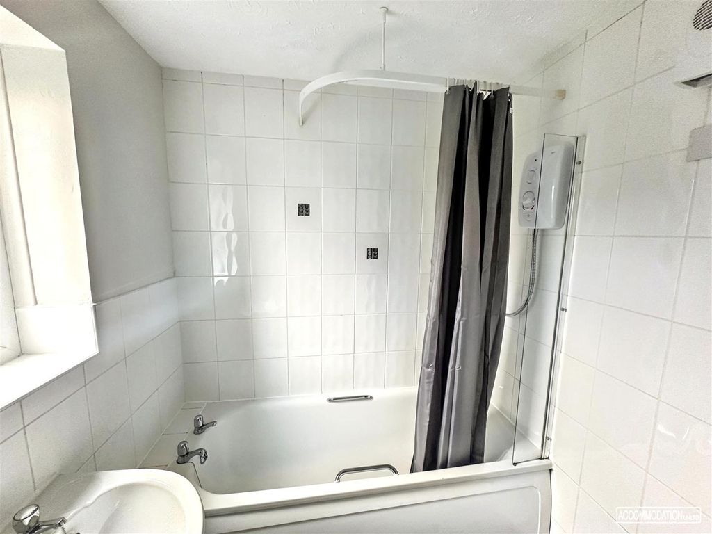 Property photo 3 of 5 Bright Bathroom With A Full Bathtub And Shower...