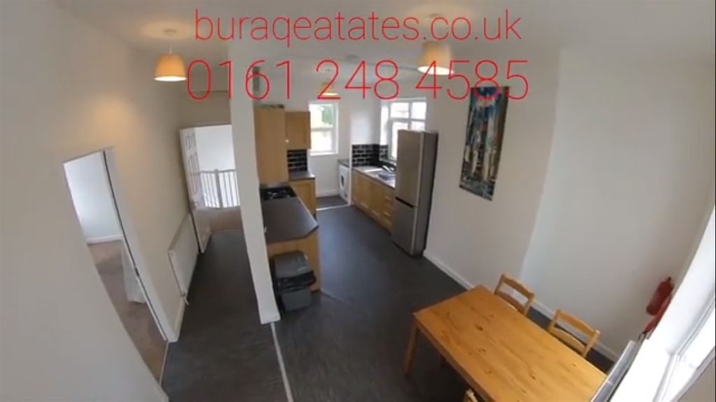 Property photo 2 of 13 Bright, Modern Galley-Style Kitchen With Integrate...