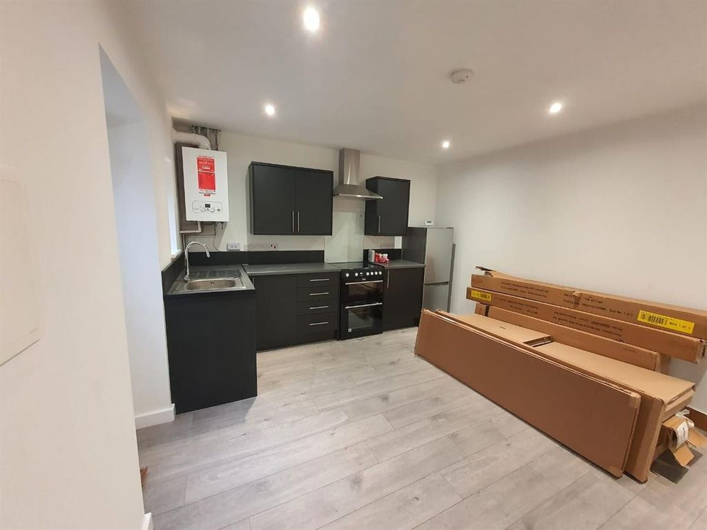 Property photo 2 of 15 Modern Kitchen With Sleek Dark Cabinets...
