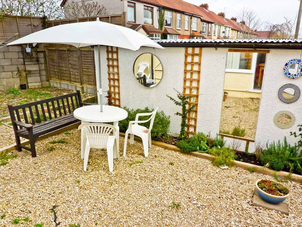 Property photo 3 of 6 A Charming Garden Space Featuring A Round Table Wi...