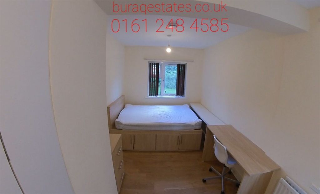 Property photo 2 of 13 A Well-Lit Bedroom Featuring A Comfortable Double ...