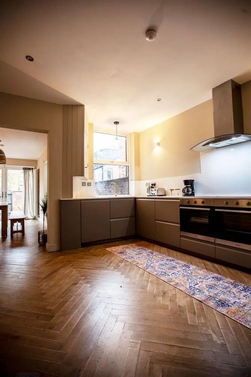 Property photo 3 of 9 Modern Kitchen With Ample Counter Space...