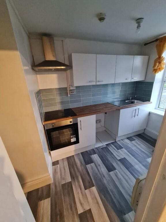 Property photo 1 of 5 Modern Compact Kitchen With White Cabinets, Stainl...