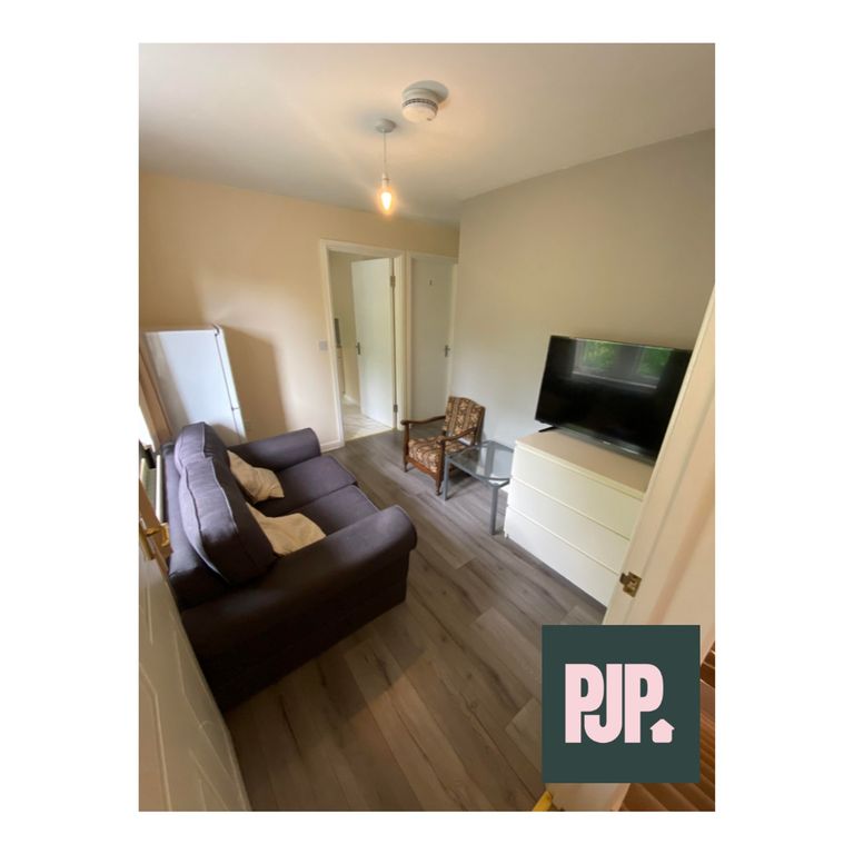 Property photo 3 of 6 A Cozy Living Room With Modern Decor, Perfect For ...