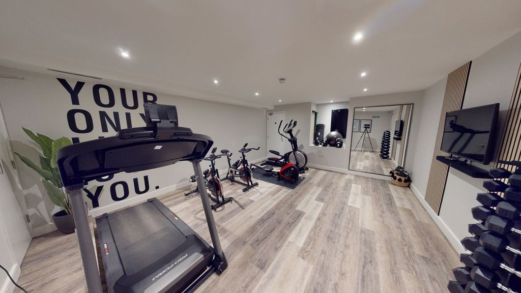 Property photo 3 of 13 A Spacious And Well-Lit Gym Equipped With Modern E...