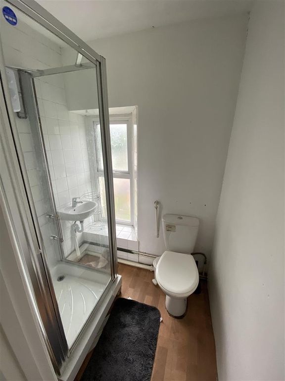 Property photo 3 of 8 Bright Bathroom With Walk-In Shower And Window....