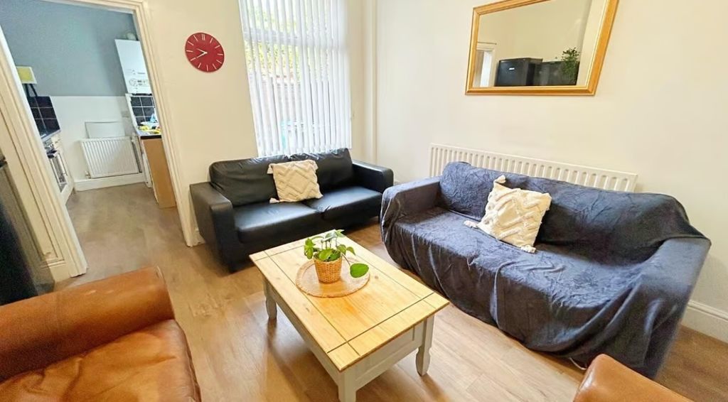 Property photo 2 of 10 A Cozy Living Room Featuring Comfortable Seating, ...