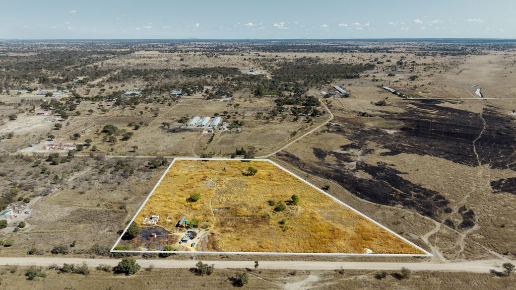 Property photo 1 of 2 Aerial View Of Arid Countryside With A Triangular Fenced Plot Of Yellow Grass In The Foreground, Surrounded By Roads And Sparse Buildings.