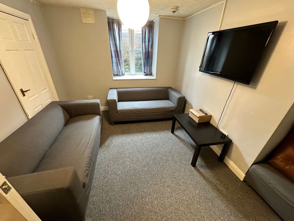 Property photo 2 of 6 A Cozy Living Room Featuring Two Comfortable Sofas...