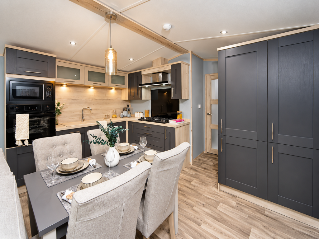 Property photo 3 of 6 Contemporary Kitchen With Integrated Appliances, Ample Storage And Dining Area